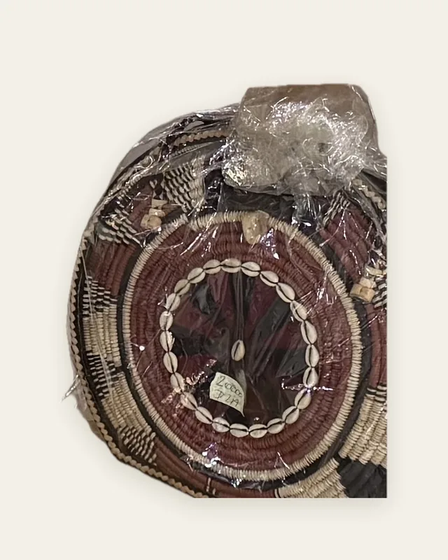 Sac à main rond en cuir, à panneau avant de fibre tressée